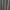 Détail de la texture matelassée du rideau gris